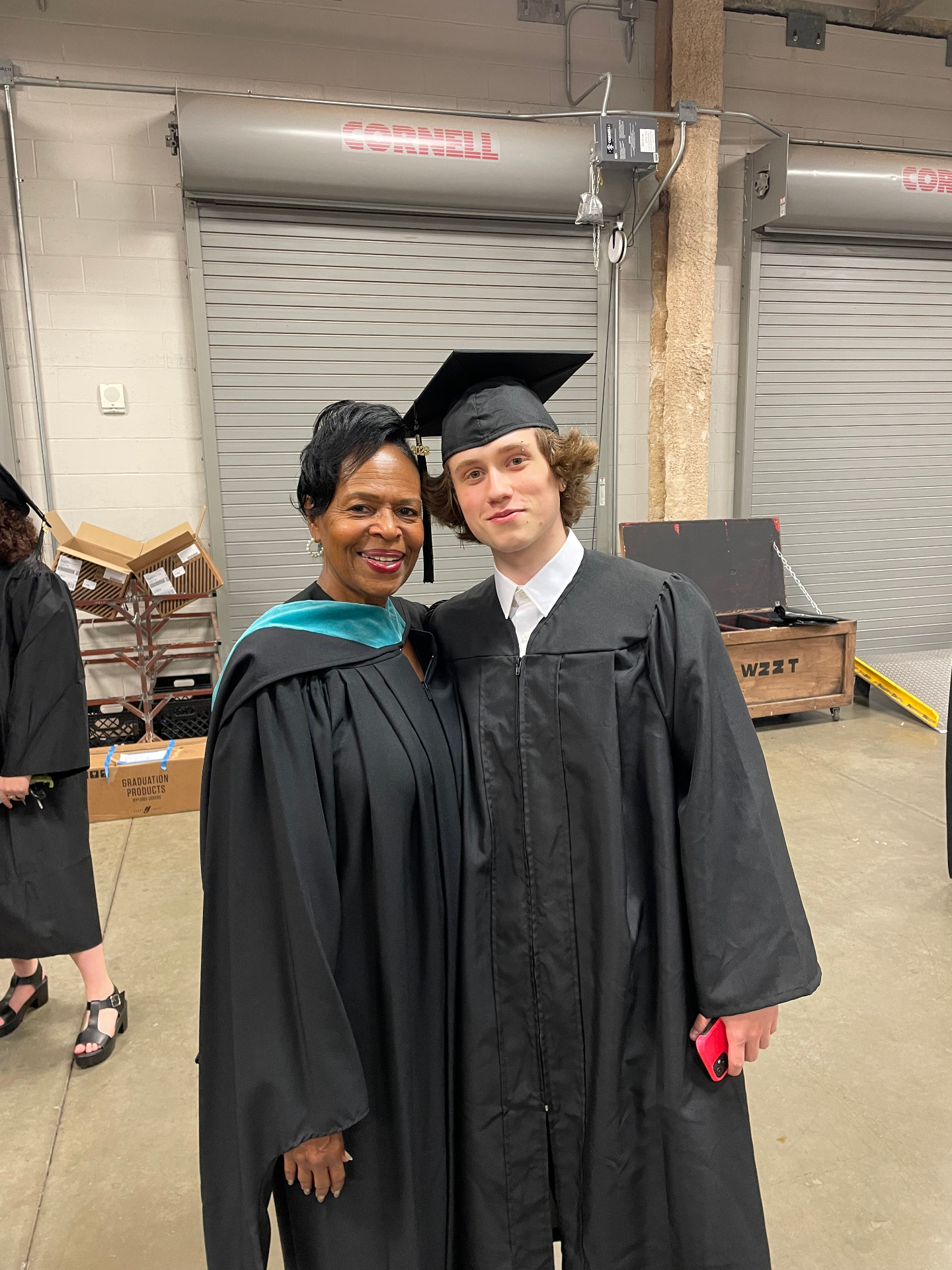 Marilyn celebrating with a graduating student